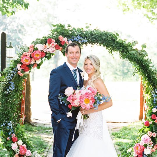 bride and groom with flowers